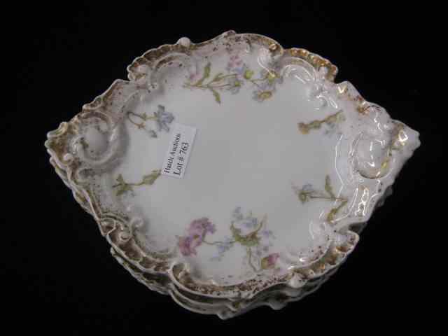 Appraisal: Limoges Porcelain Dessert Plates fancy shape floral sprays gold trim