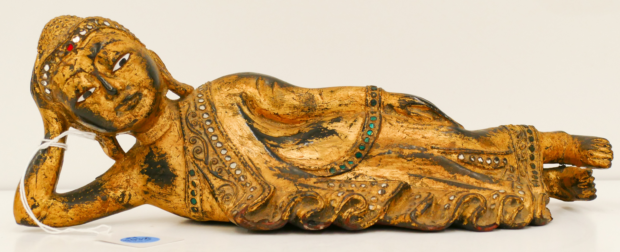 Appraisal: Thai Gilt Jeweled Wood Reclining Buddha ''x ''