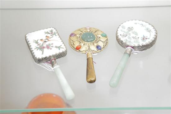 Appraisal: THREE MINIATURE HAND MIRRORS Two having jadeite handles with enamelled