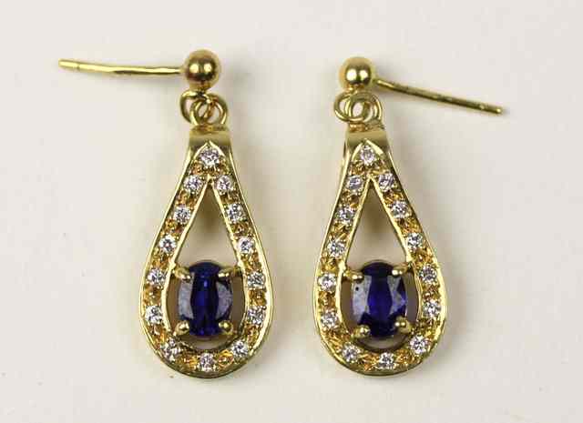 Appraisal: A pair of sapphire and diamond tear shape ear pendants