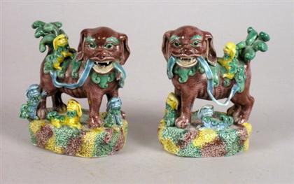 Appraisal: Pair of Chinese sancai glazed porcelain Fu lions early qing