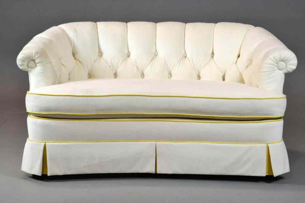 Appraisal: A Fine Mid Century Hollywood Regency SofaPetite sofa upholstered in