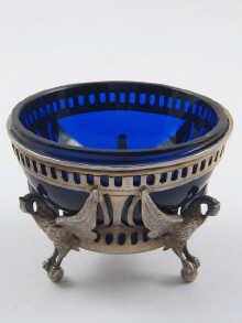 Appraisal: A Russian silver salt with blue glass liner the frame