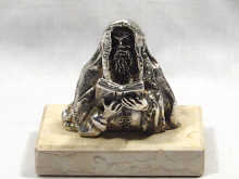 Appraisal: A silver model of a Rabbi on an agate base