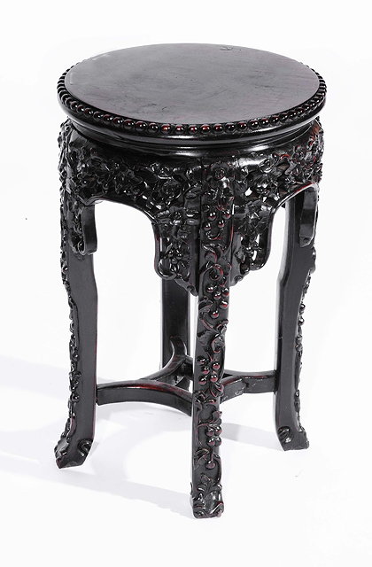 Appraisal: A Chinese rosewood urn stand th Centurywith circular top and