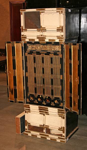 Appraisal: A lacquered wood four-section butsudan With black and gilt lacquered