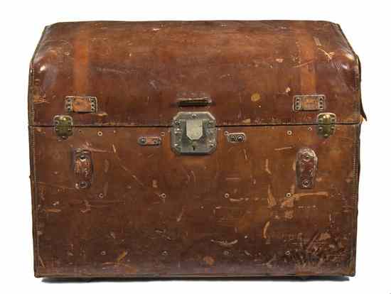 Appraisal: A Leather Clad Trunk having a domed hinged lid over