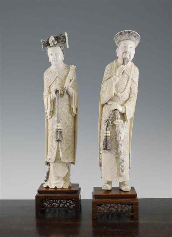 Appraisal: A pair of large Chinese ivory figures of the Emperor