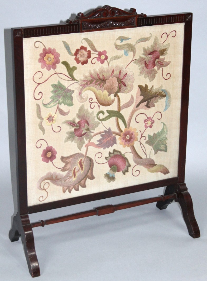 Appraisal: An early thC mahogany framed firescreen the centre embroidered with