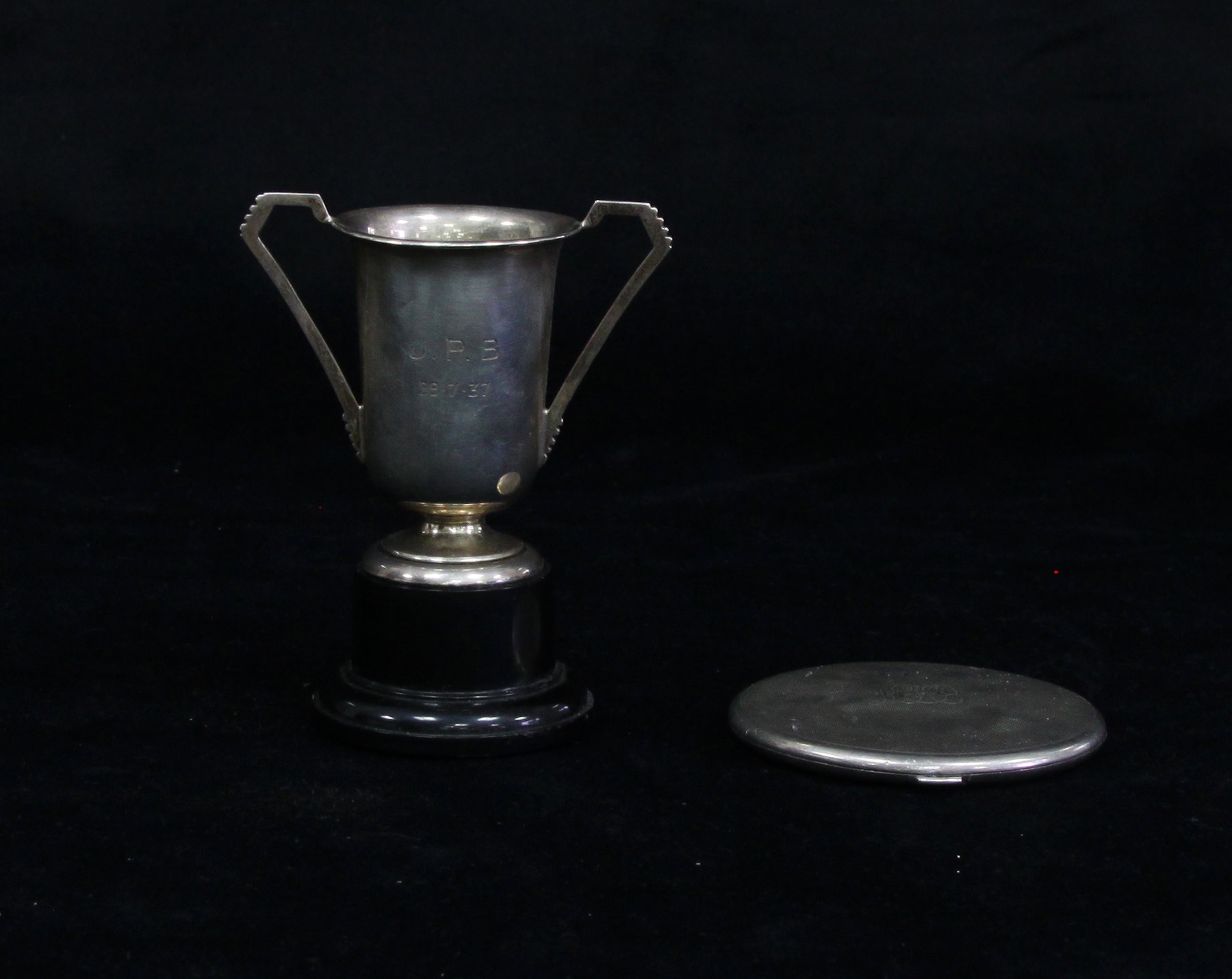 Appraisal: A silver compact Birmingham initialled and with engine turned decoration