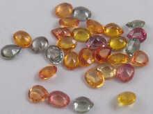 Appraisal: A quantity of loose polished various coloured sapphires total weight