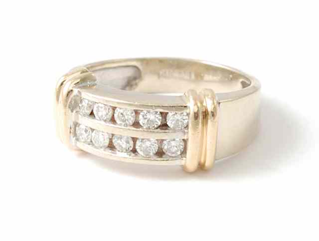 Appraisal: DIAMOND AND FOURTEEN KARAT GOLD RING the white gold band