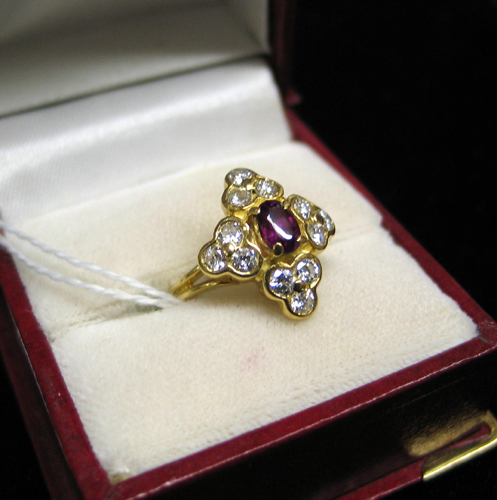 Appraisal: RUBY DIAMOND AND EIGHTEEN KARAT GOLD RING Twelve round-cut diamonds