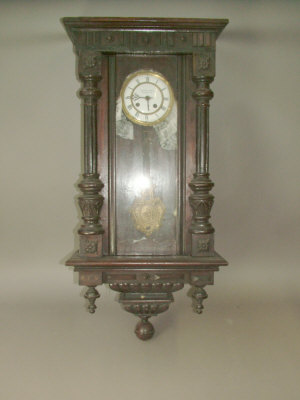 Appraisal: A German wooden cased regulator type wall clock the case