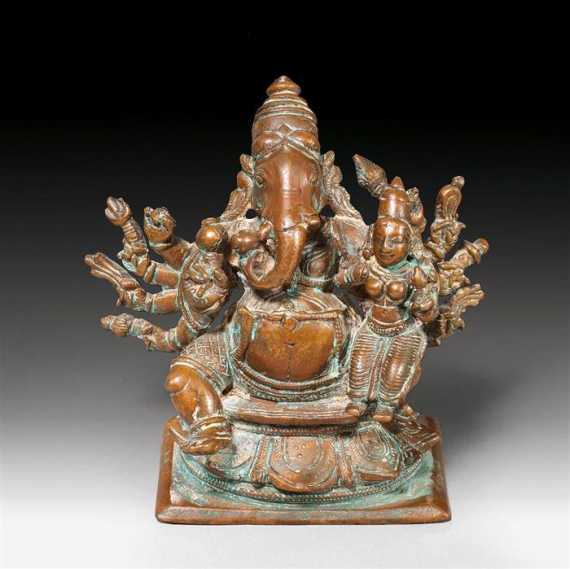 Appraisal: A SMALL COPPER FIGURE OF GANESHA WITH HIS CONSORT India