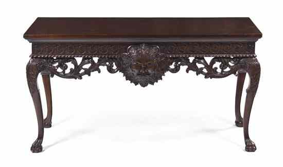 Appraisal: A Renaissance Revival Style Carved Console Table likely Irish having