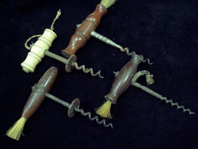 Appraisal: A corkscrew with turned ivory handle and three other corkscrews