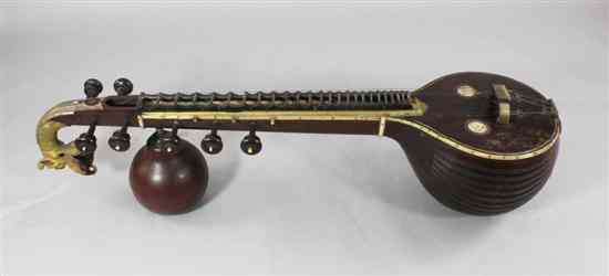 Appraisal: A th century Indian painted gilt and brass inlaid saraswati