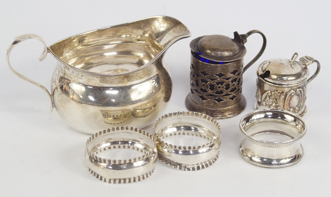 Appraisal: A George VI silver cream jug Birmingham three napkin rings