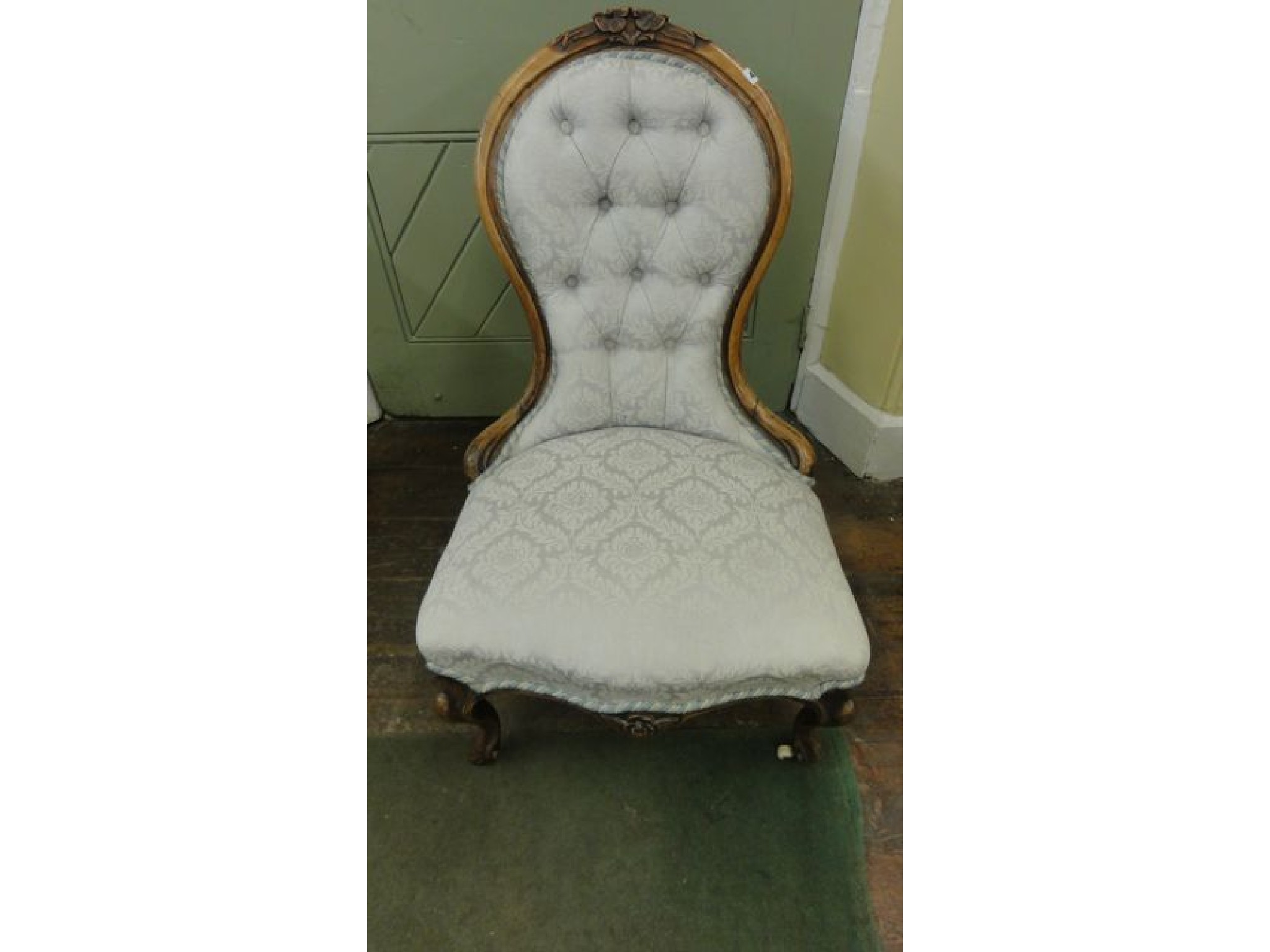 Appraisal: A Victorian walnut spoonback drawing room chair with carved showood