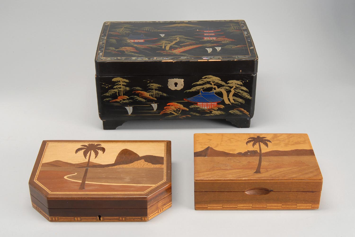 Appraisal: THREE JEWELRY BOXES Includes a Japanese inlaid lacquer musical jewelry