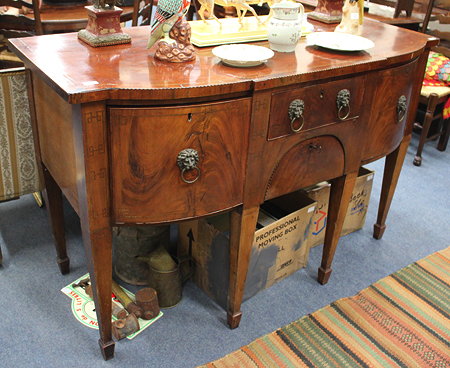 Appraisal: A GEORGIAN MAHOGANY BOW FRONTED SIDE BOARD the top with