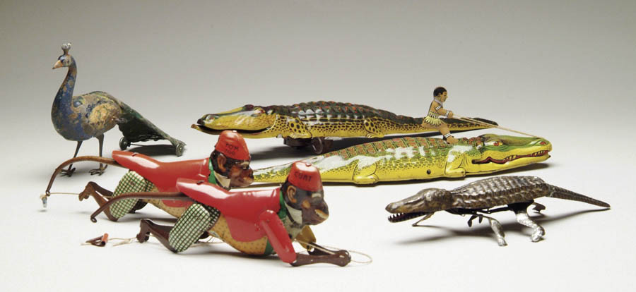 Appraisal: LOT OF TIN TOYS Consists of Chein alligator with native