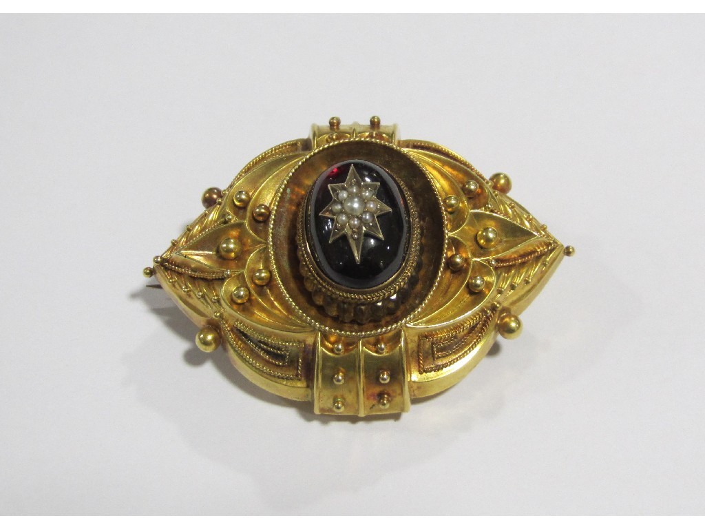 Appraisal: Victorian unmarked gold balloon brooch with cabochon garnet centre inset