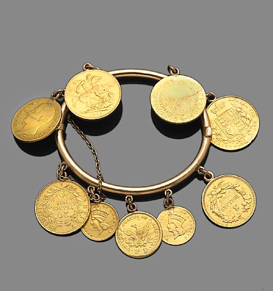 Appraisal: A gold coin bangle bracelet suspending nine gold coins of