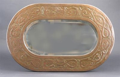 Appraisal: An Irish hammered copper wall mirror attributed to Fivemiletown rounded