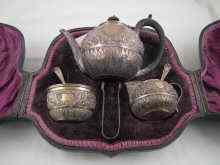 Appraisal: A silver three piece ''tete a tete'' tea set in