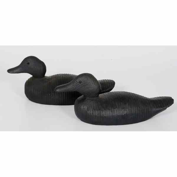 Appraisal: Pair of Ebonized Wood Duck Decoys Two wooden duck decoys