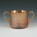 Appraisal: Carnival glass handled sugar bowl Unmarked Good condition with a