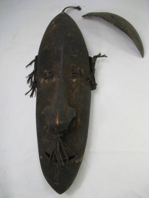 Appraisal: Primitive style carved wood mask with shell eyes and accented