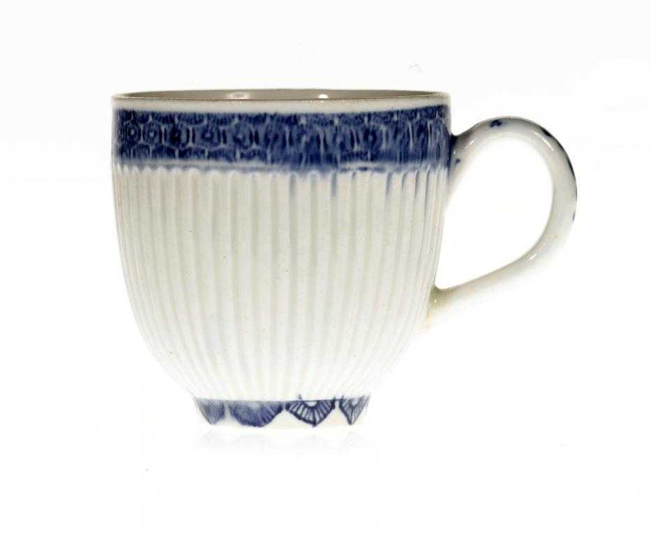 Appraisal: A BOW REEDED COFFEE CUP painted in underglaze blue with