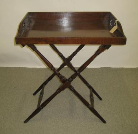 Appraisal: A MAHOGANY BUTLER'S TRAY ON STAND th century the oblong