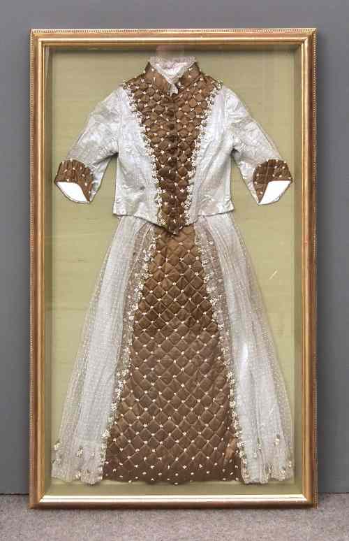 Appraisal: A Victorian embroidered brown silk and lace wedding dress later