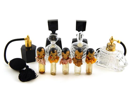 Appraisal: Mid-Century perfume bottles seven pieces pair black cased glass bottles