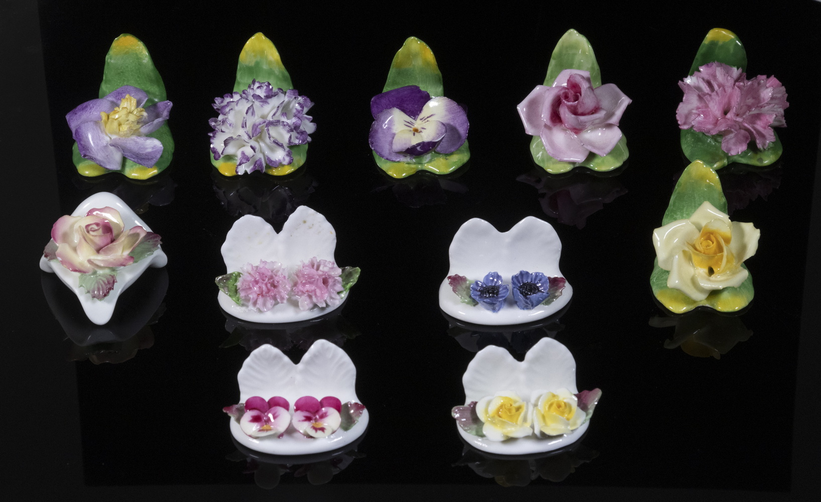 Appraisal: ENGLISH PORCELAIN PLACE CARD HOLDERS Lot of Floral Form Place