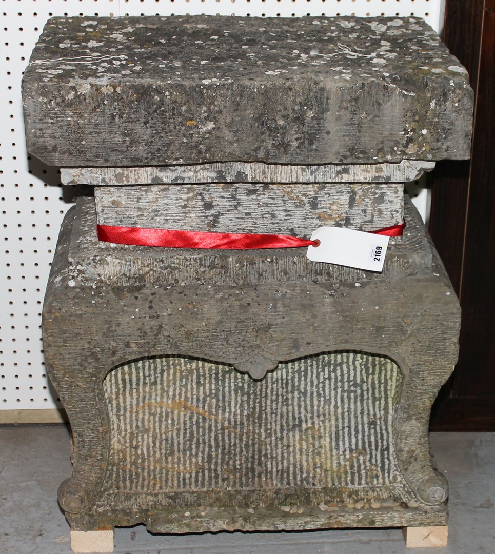 Appraisal: A pair of carved granite stands of shaped retangular form