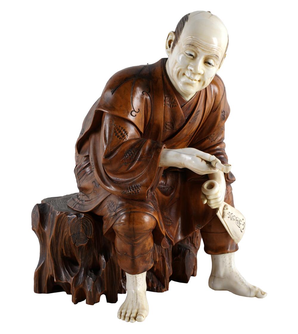 Appraisal: JAPANESE CARVED BOXWOOD FIGURE OF A SEATED MANinset signature seal