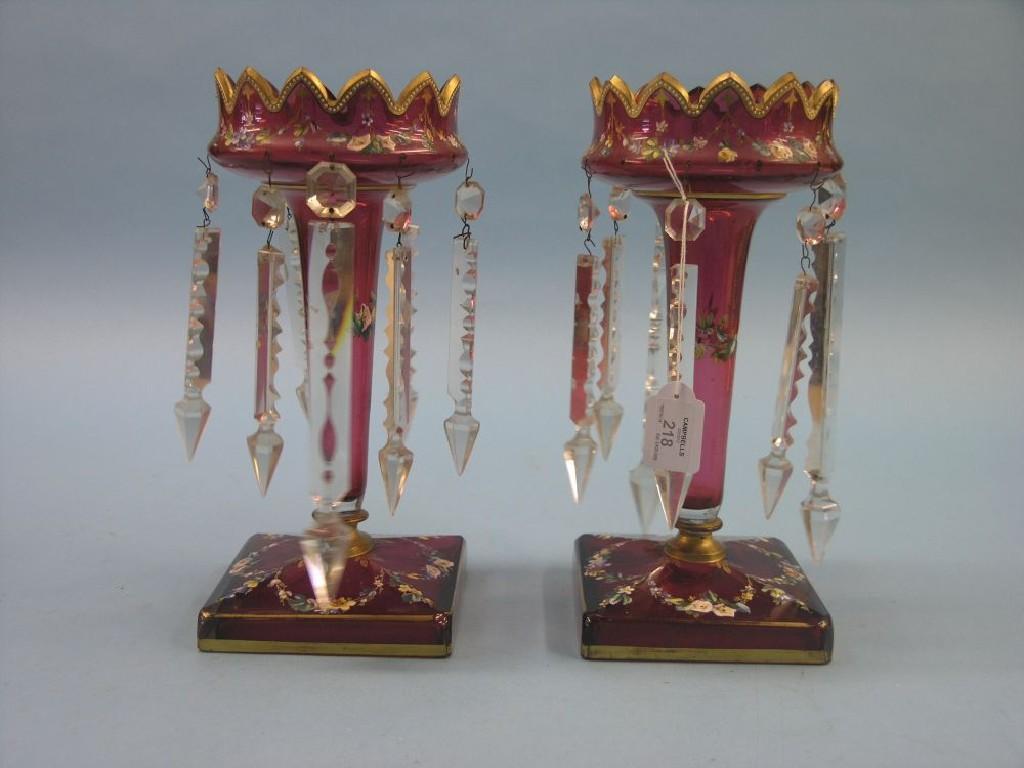 Appraisal: A pair of Victorian ruby glass table lustres gilded and