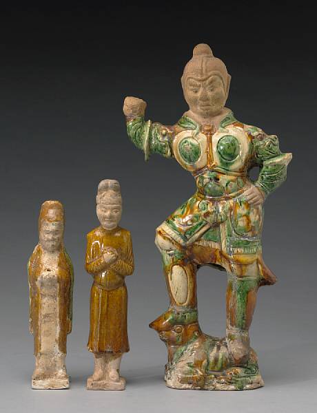 Appraisal: Three glazed pottery figures Tang Dynasty The first a lokapala