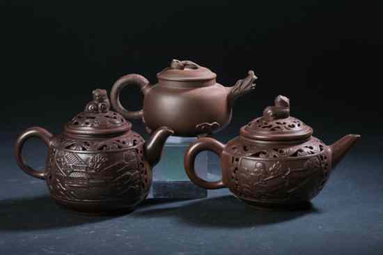 Appraisal: THREE CHINESE YIXING TEA POTS One with shen jin xi