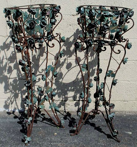 Appraisal: Pair of wrought iron plant stands with applied floral and