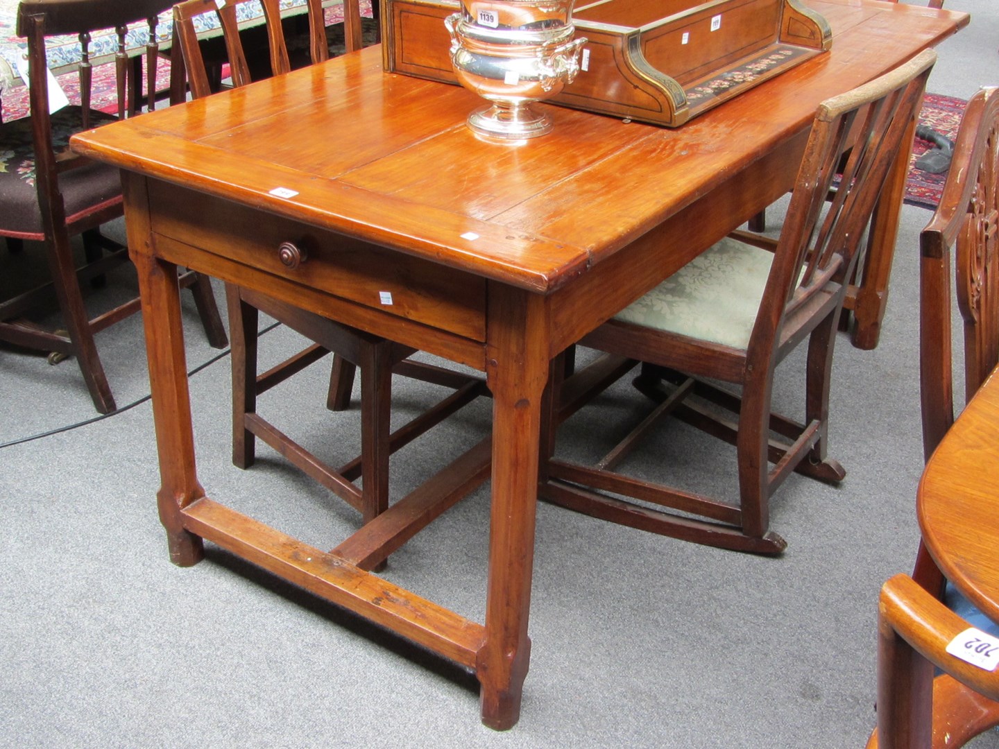 Appraisal: A th century French fruitwood farmhouse kitchen table with pair