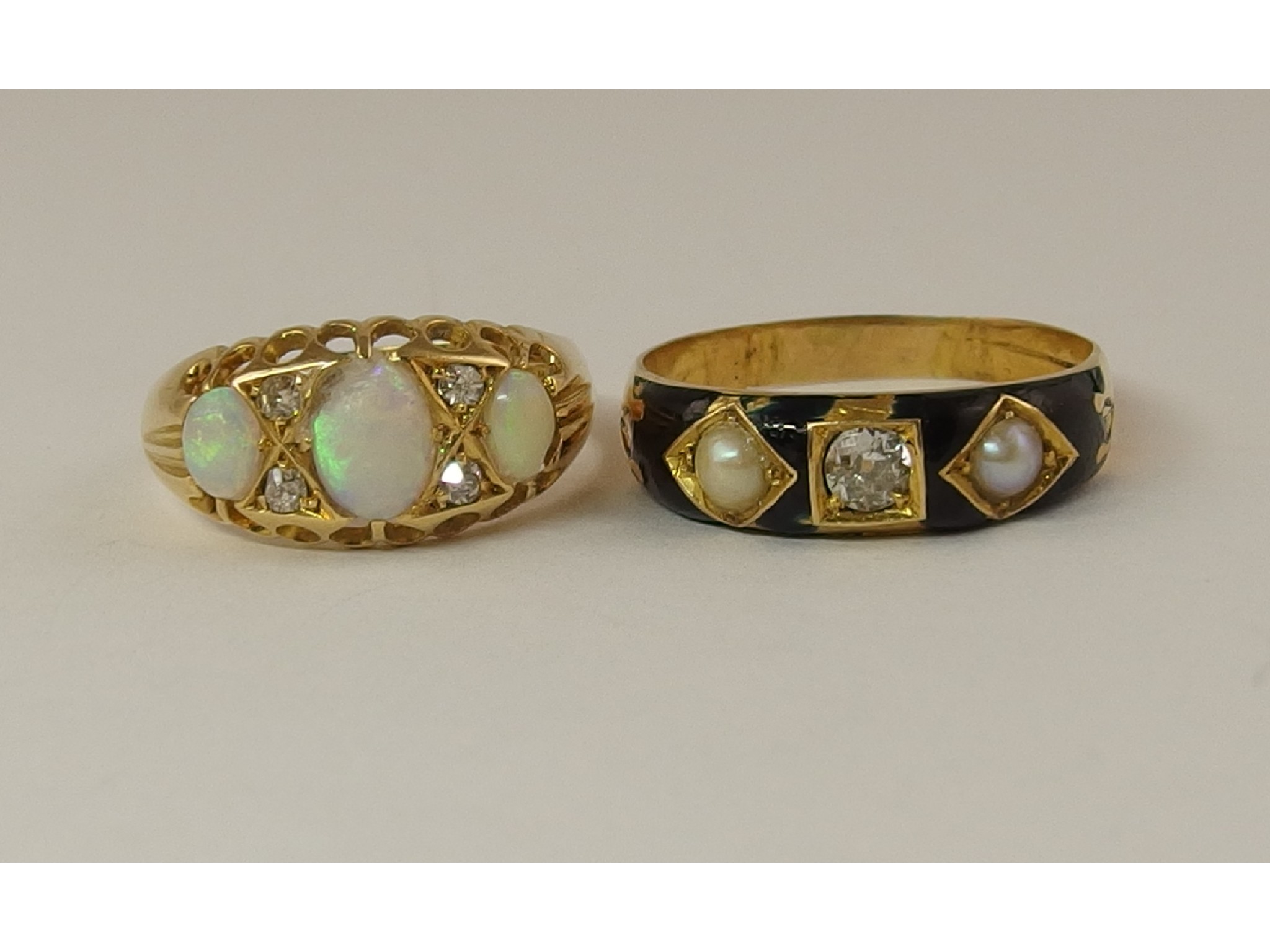 Appraisal: A yellow metal black enamel diamond and pearl mourning ring