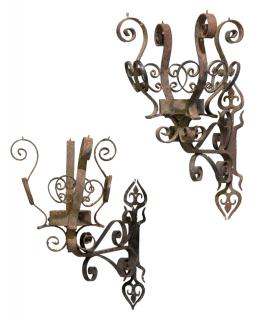 Appraisal: A PAIR OF SCROLLED WROUGHT IRON SINGLE-LIGHT SCONCES th century