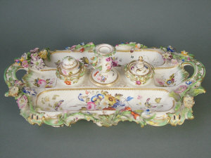 Appraisal: English porcelain flower encrusted part desk set with pierced green