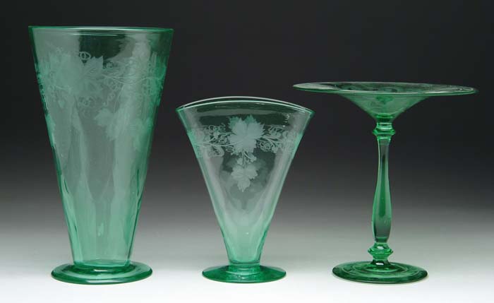 Appraisal: THREE COLORED CRYSTAL ITEMS Green crystal vase with engraved grape